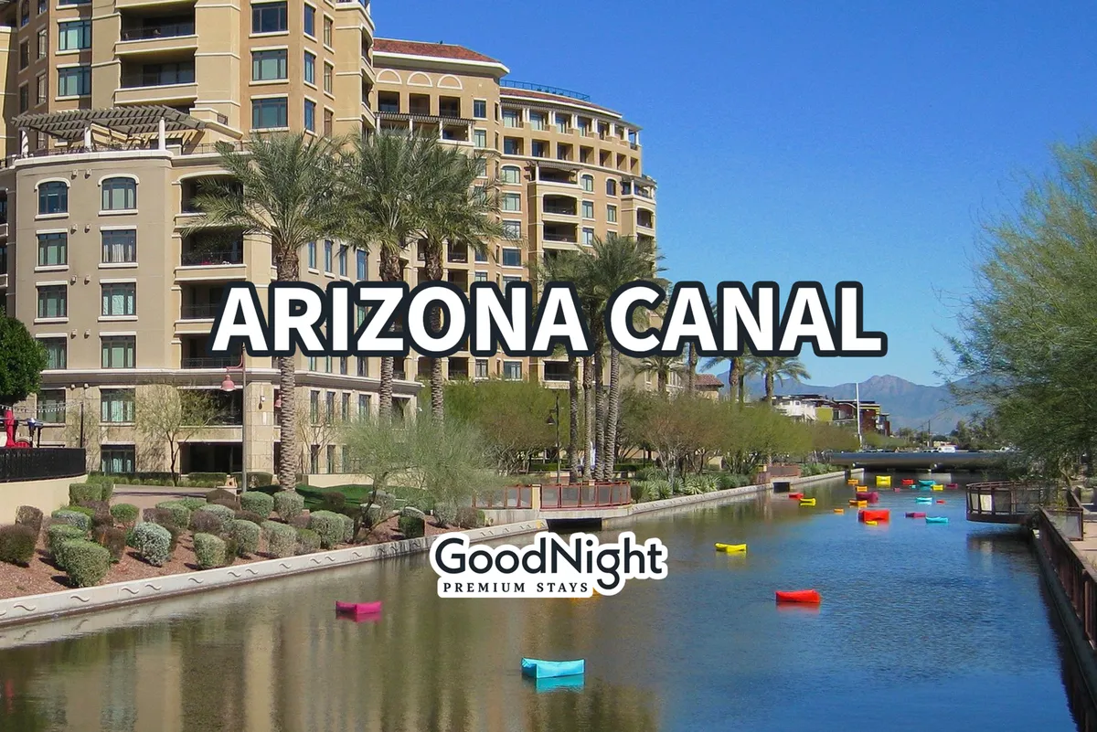 A lively scene along the Arizona Canal, with colorful boats, palm trees, and modern architecture. The canal is lined with scenic pathways, ideal for romantic strolls to nearby cafes, restaurants, and art galleries.